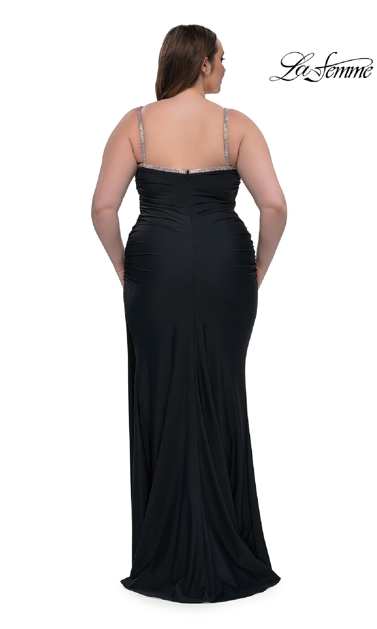 A woman wearing the Plus-Size Long Prom Dress: La Femme 32992, a black bead-trimmed gown with elegant straps, is shown from the back against a white background. The La Femme logo is in the top right corner.